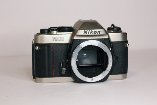 Nikon FM10 camera body - works but in very rough conditon - As-Is
