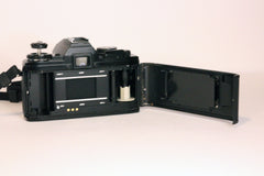 Minolta X-700 camera seen from behind, back film door open