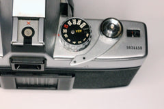 Minolta SRT-MCii seen from above - close on the film advance crank showing the absence of the black plastic tip